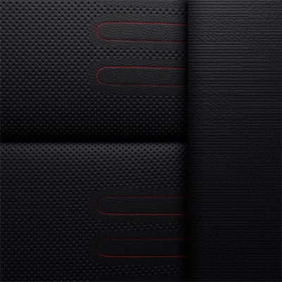 مقاعد مكسوة بالجلد المحبّب بالكامل بلون أوبسيديان راش مع لمسات باللون الأحمر