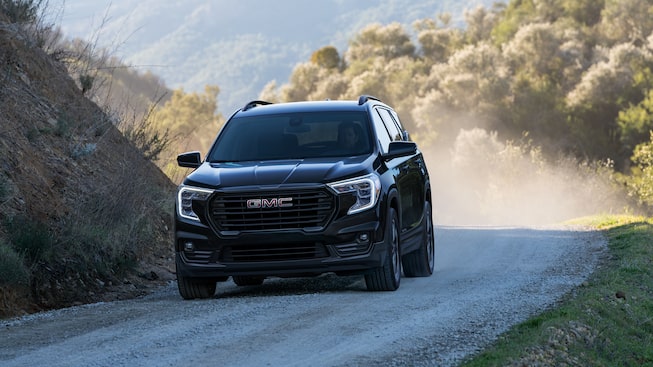 Ebony Twilight Metallic GMC Terrain SLT Driving Off-Road Kicking Up Dirt