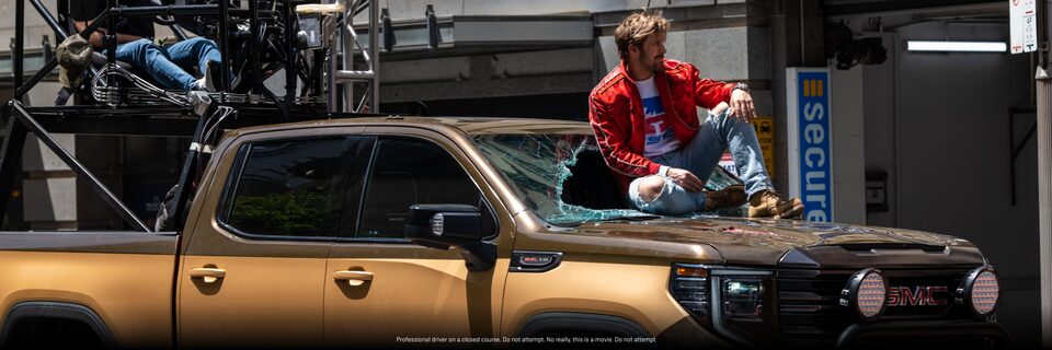 Ryan Gosling Sitting on Top of a GMC Sierra 1500 AT4X in a scene for his Movie The Fall Guy