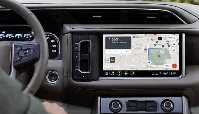 An Interior Shot of a GMC Vehicle Dashboard with the Infotainment Screen Displaying a Navigation Map