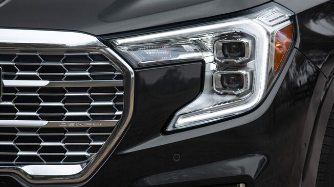 The 2023 Ebony Twilight Metallic GMC Terrain Denali Headlamps