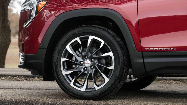 Closeup On Rims and Tires on the Red GMC Terrain SLT