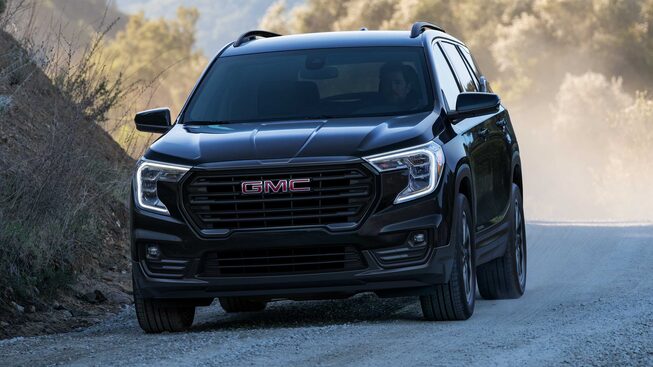Ebony Twilight Metallic GMC Terrain SLT Driving Off-Road Kicking Up Dirt