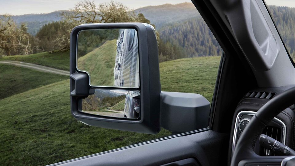 The 2023 GMC Sierra HD Trailering Mirrors with a Gorgeous Mountain Backdrop