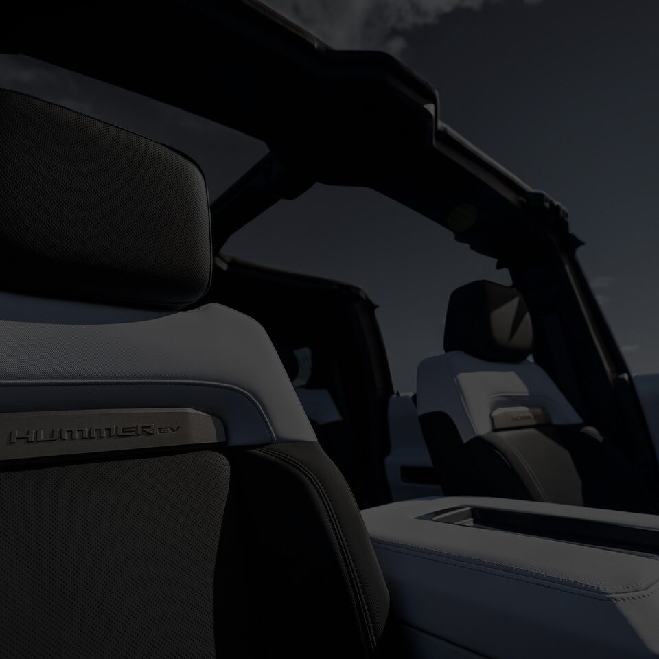 Interior Seats of the Hummer EV Pickup Truck with a Dark Tint Over the Image with a Text Overlay of "View Interior"