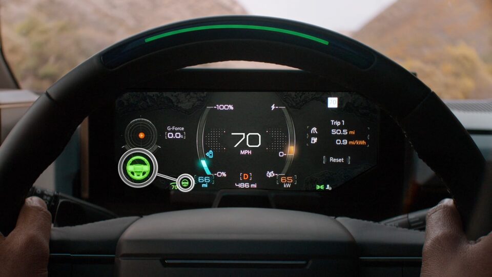 Close-Up View of the Super Cruise Feature on the 2025 Hummer EV Digital Cockpit with a Person's Hands on the Steering Wheel