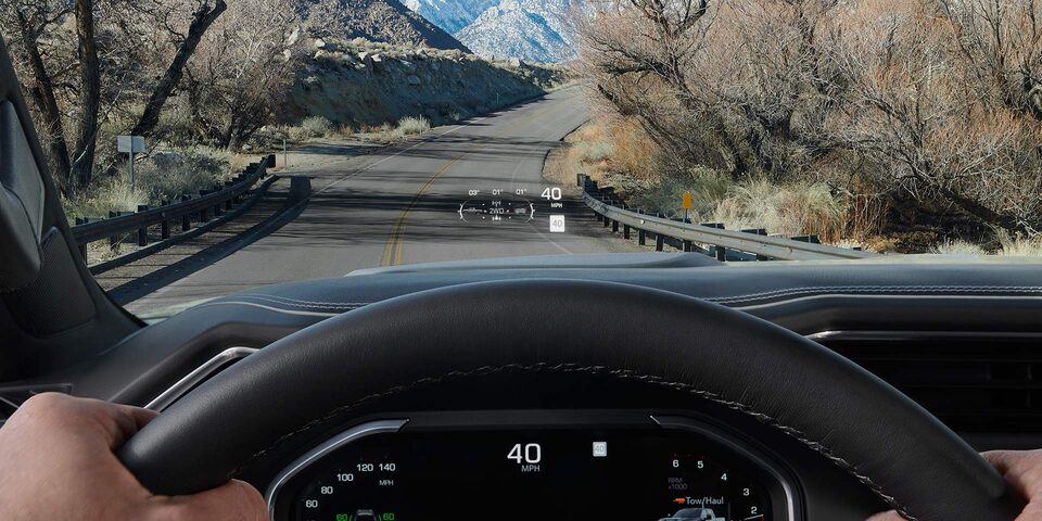 Close-up View of the Heads Up Display Feature in Use in a 2025 GMC Sierra HD AT4 Truck