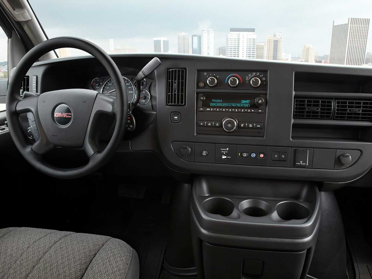 Wide Interior View of the Steering Wheel and Dashboard in a 2026 GMC Savana Cutaway Van