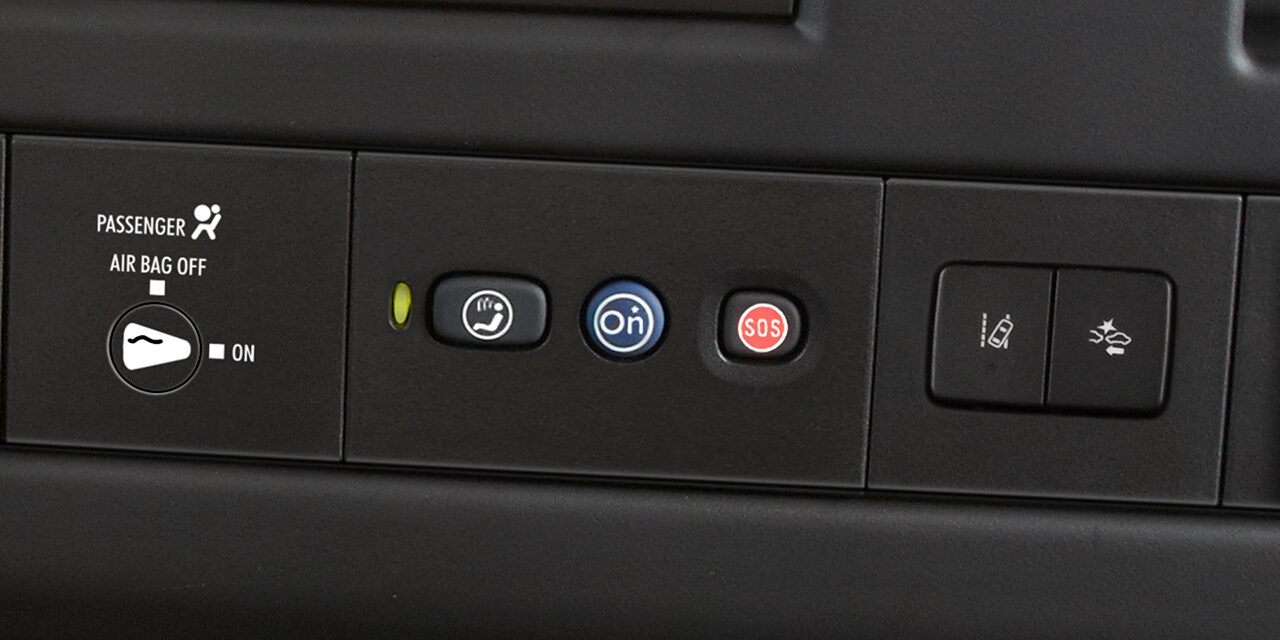 Close-Up View of OnStar and Emergency Services Buttons in a 2026 GMC Savana Passenger Van