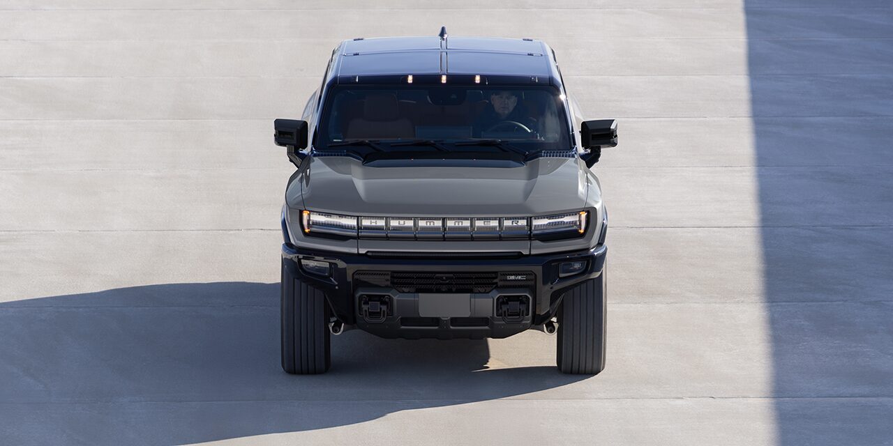 Bird's Eye View of the Front of a 2026 GMC HUMMER EV SUV Parked on a Concrete Driveway