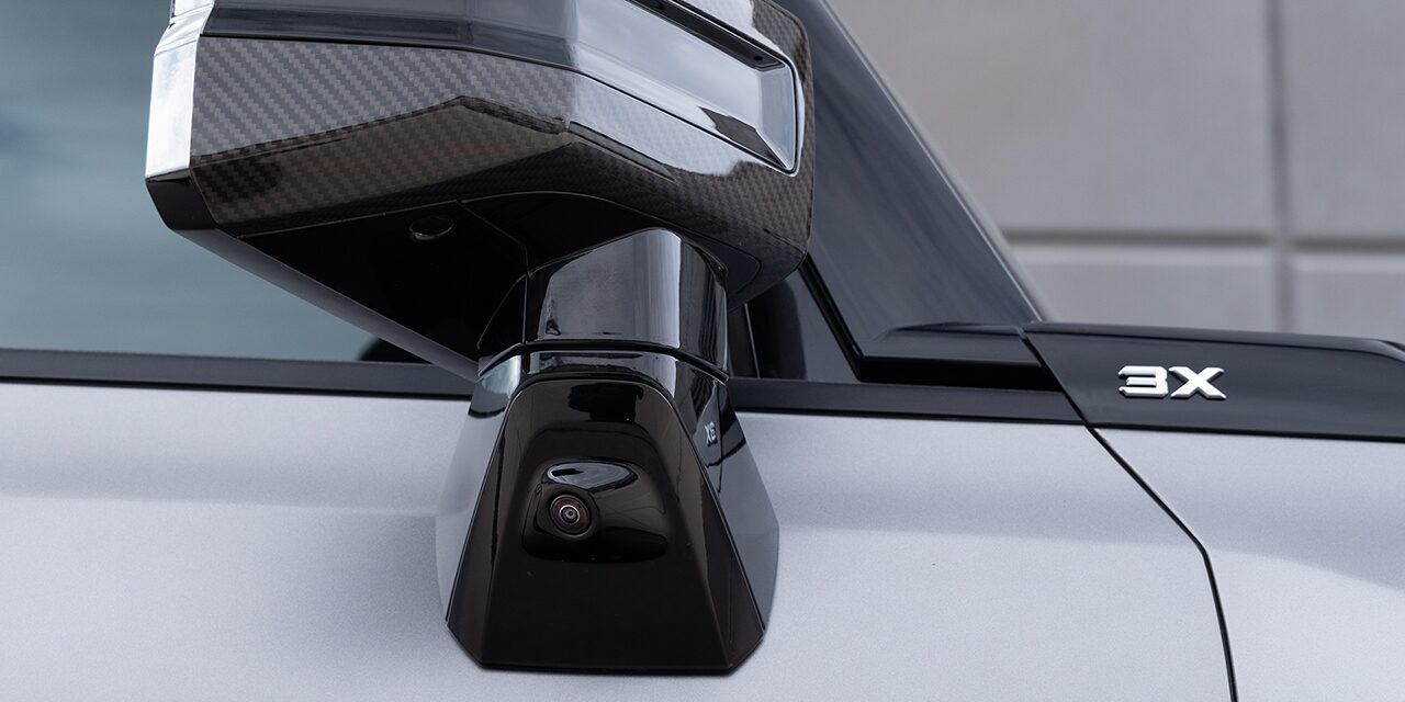 Close-up View of One of the 2026 GMC HUMMER EV SUV's Ultra Vision Cameras on the Exterior Side Mirror