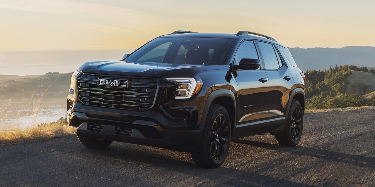 Front Three-Quarter View of the 2026 GMC Terrain Elevation Compact SUV Driving Down the Coast
