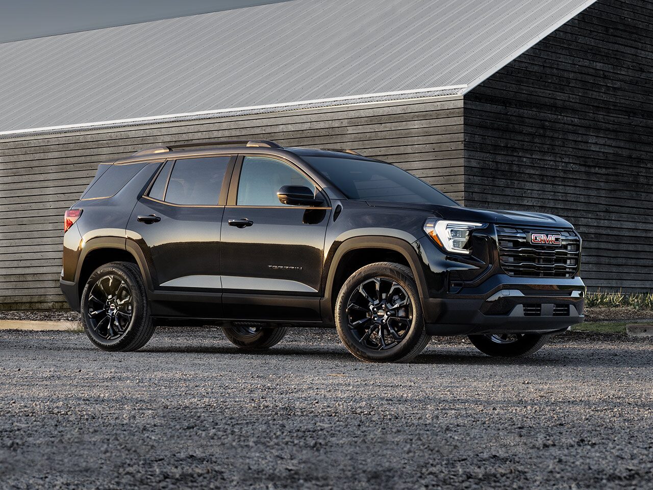 Profile View of the 2026 GMC Terrain Elevation Compact SUV Parked in a Driveway